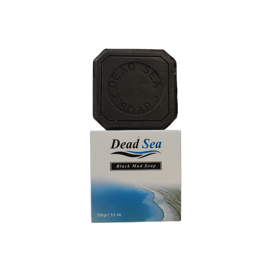Dead Sea Black Mud Soap made with Olive Oil by Nablus Soap Company, the soap is standing on top of its box with the dead sea on it.