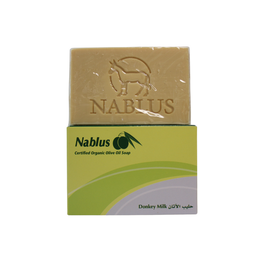 donkey milk and olive oil soap bar with packaging reading nablus certified organic olive oil soap 