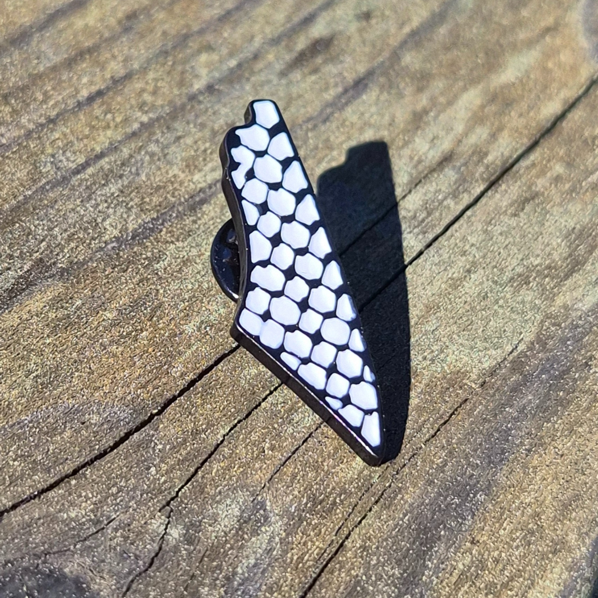 Keffiyah print palestine map enamel pin on wooden background 