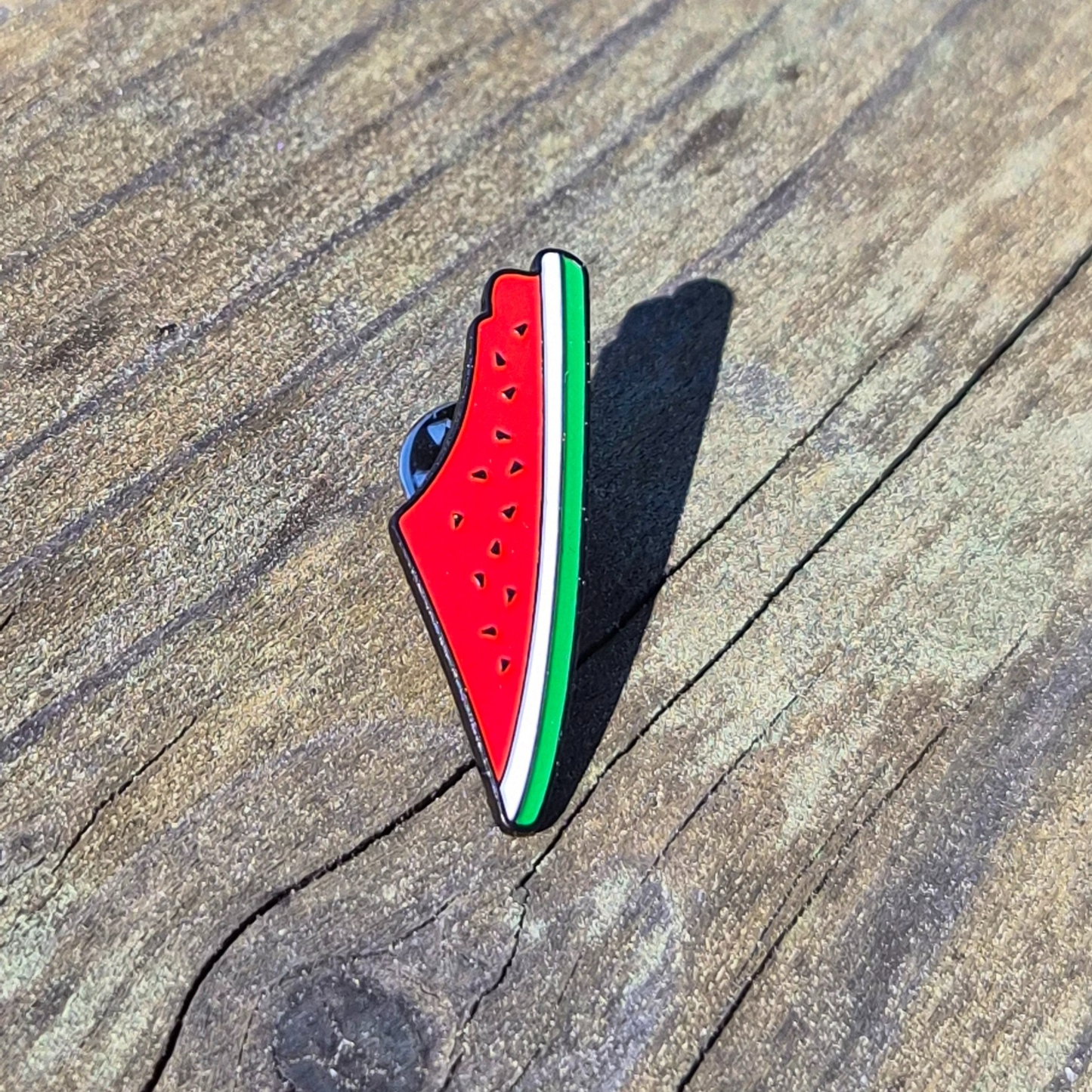 watermelon print palestine map enamel pin on wooden background 